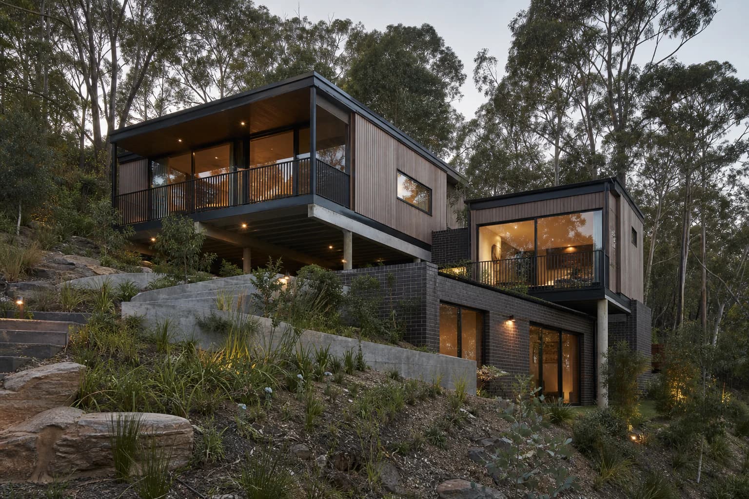Contemporary split-level home stepping down a wooded Melbourne hillside