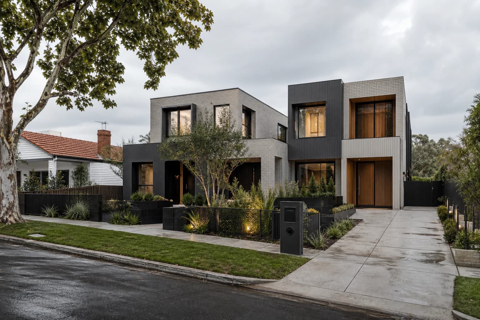 Two individually designed residences sharing one established Melbourne block