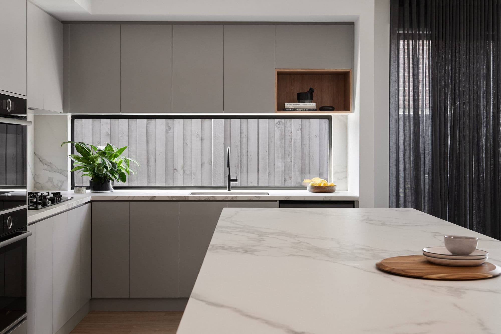 Project Amber, kitchen with marble island bench and stone splashback