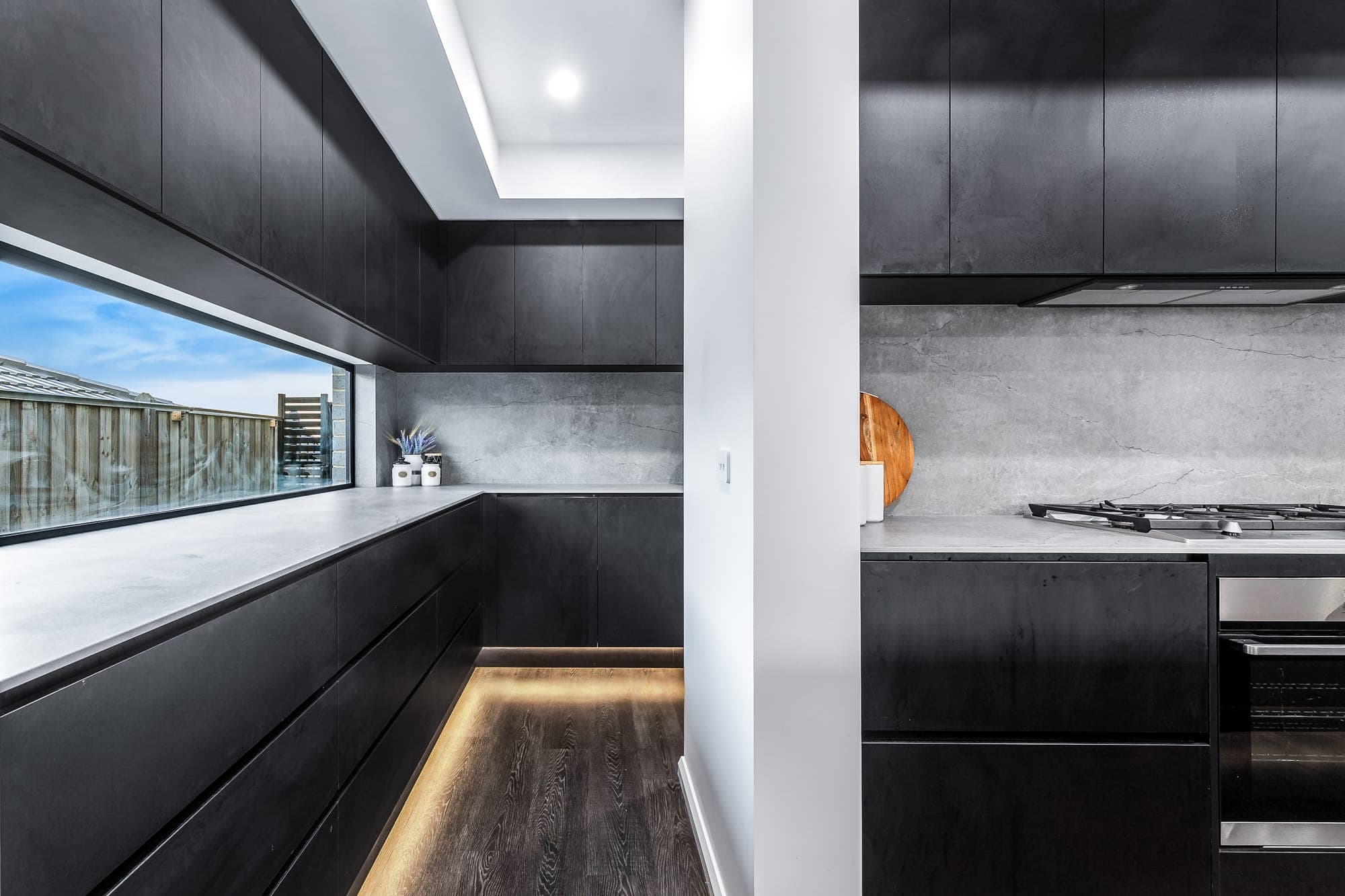 The Obsidian, dark butler's pantry with window splashback