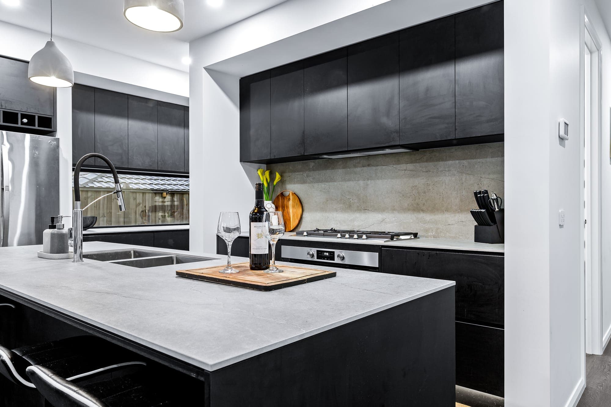 The Obsidian, dark kitchen with stone benchtops, Melbourne south east