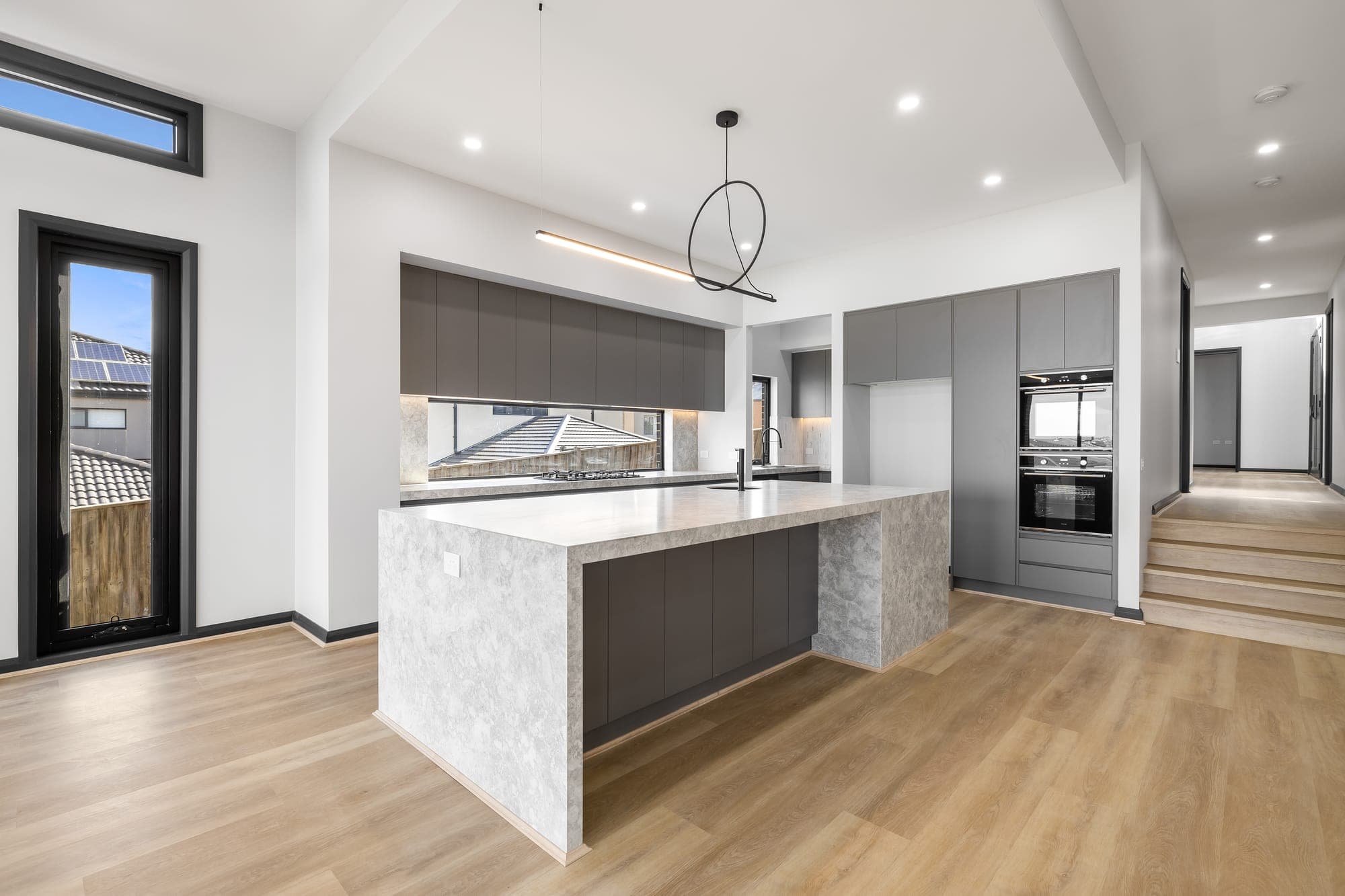 Project Solstice, kitchen island with split-level steps beyond