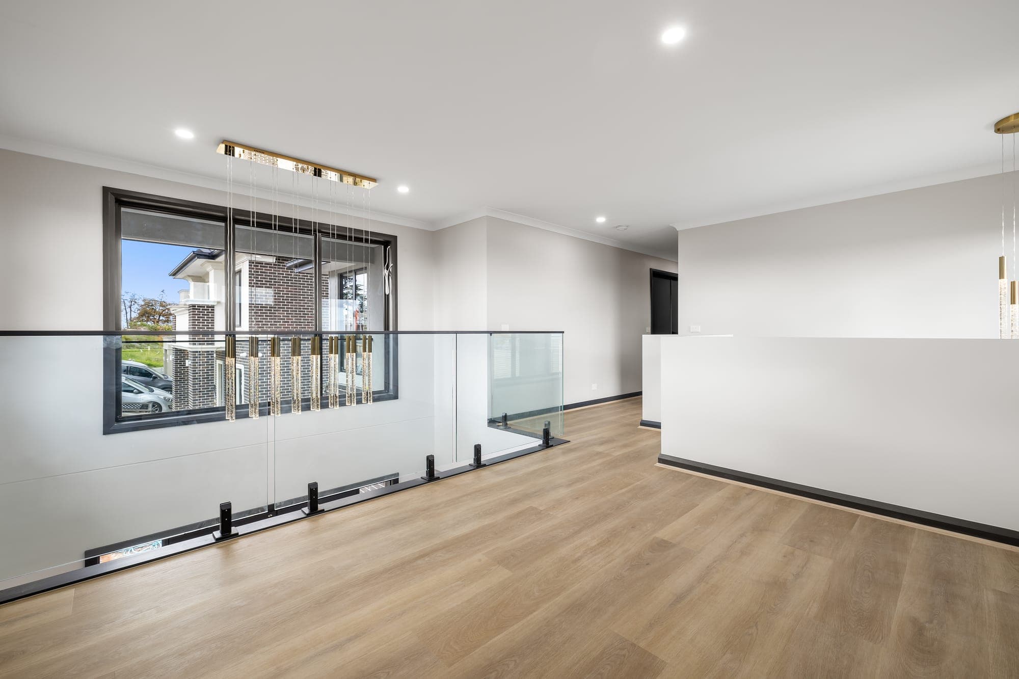 Project Solstice, upper landing with glass balustrade