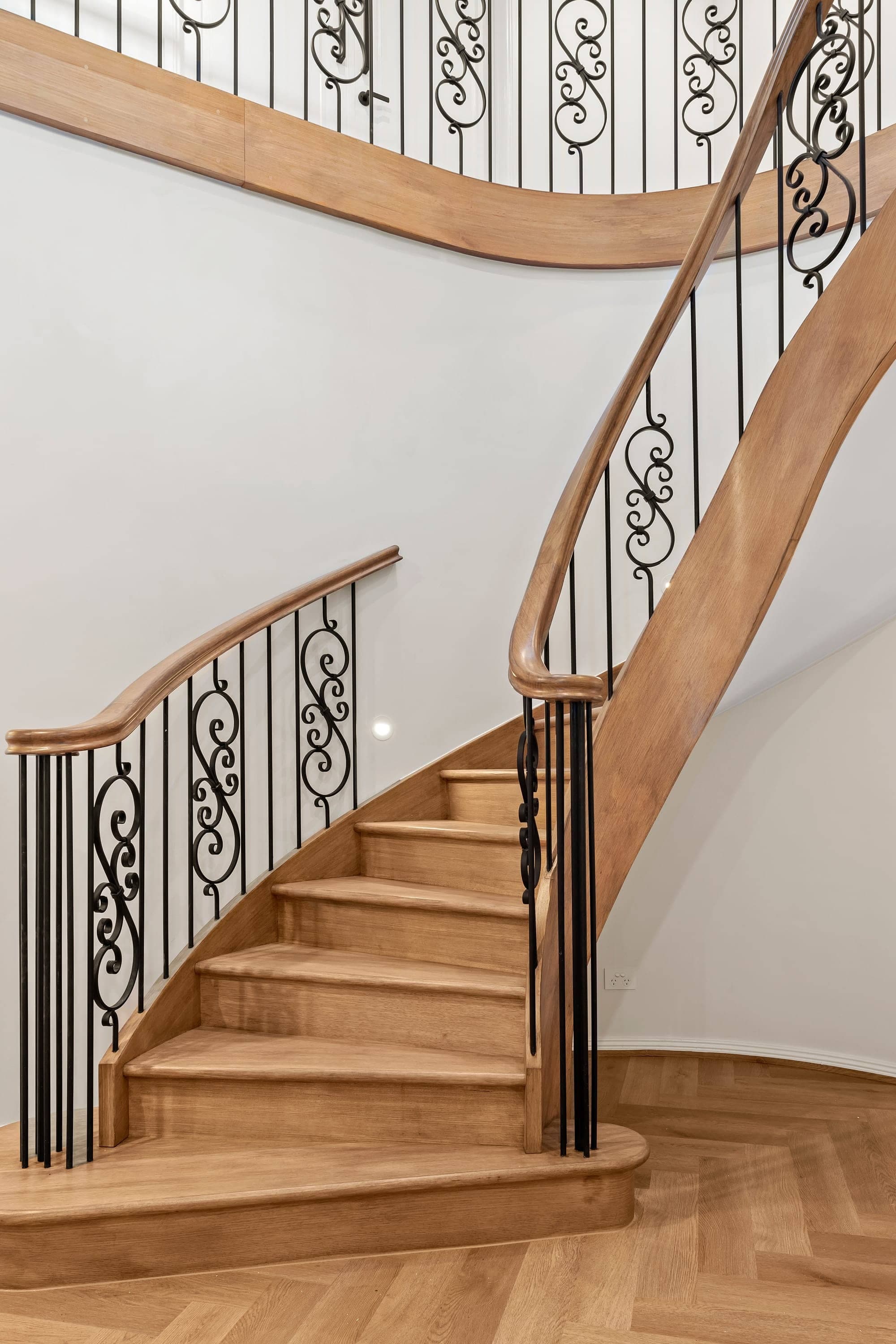 The Marquise, curved staircase with wrought-iron balustrade, Oakleigh South