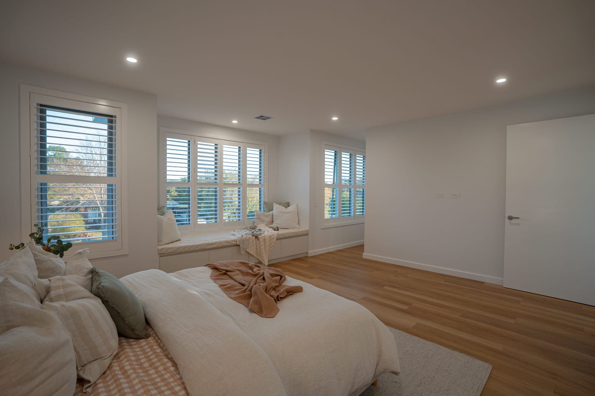 The Willow, master bedroom with plantation shutters, Rowville