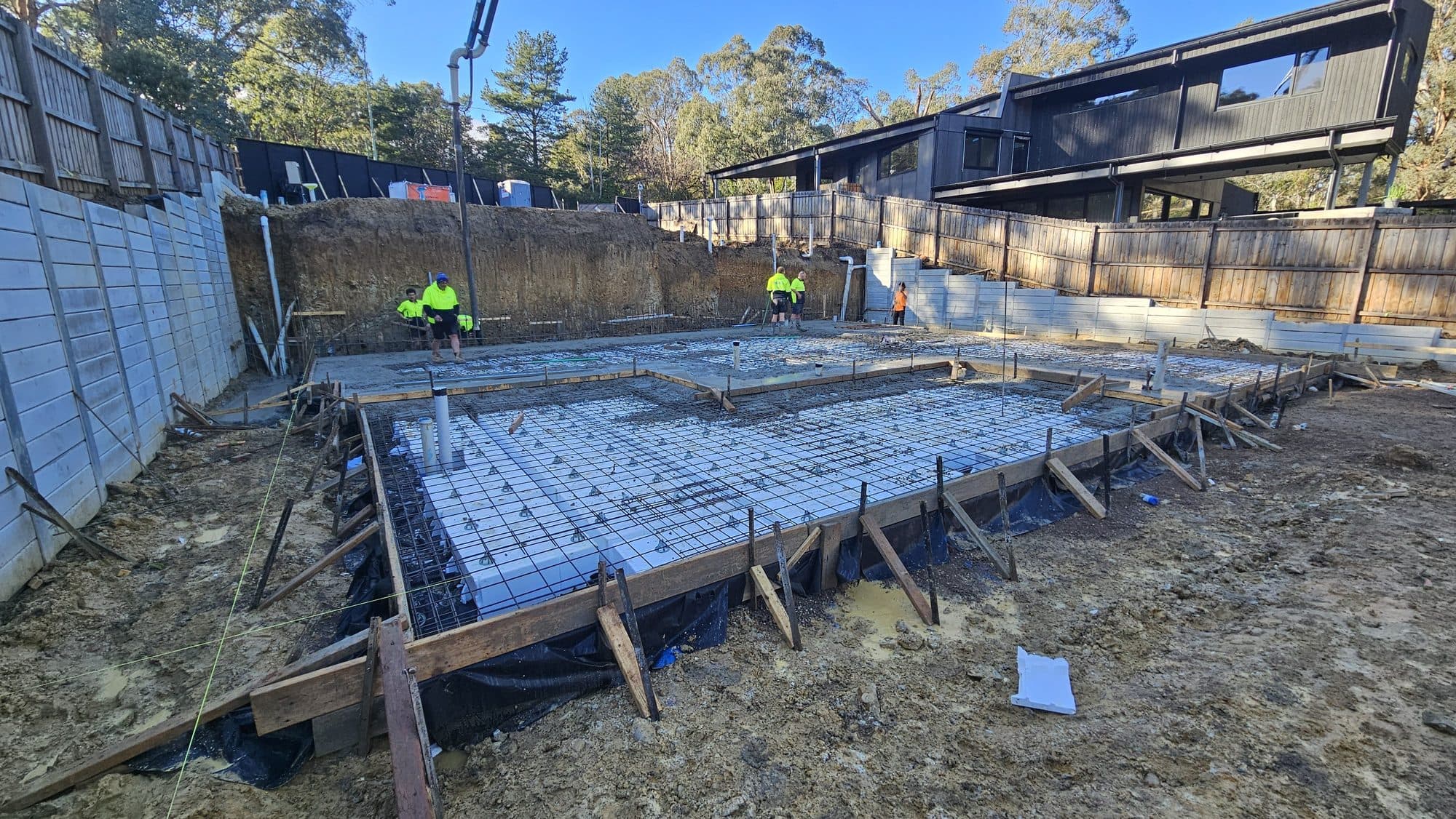 Waffle pod slab with reinforcement ready for the concrete pour on an excavated sloping block in Warrandyte