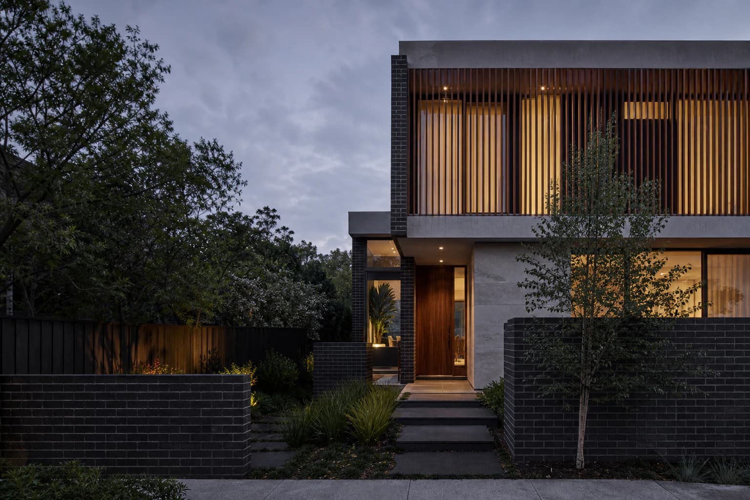 Bespoke contemporary Melbourne home with layered brick, stone and timber